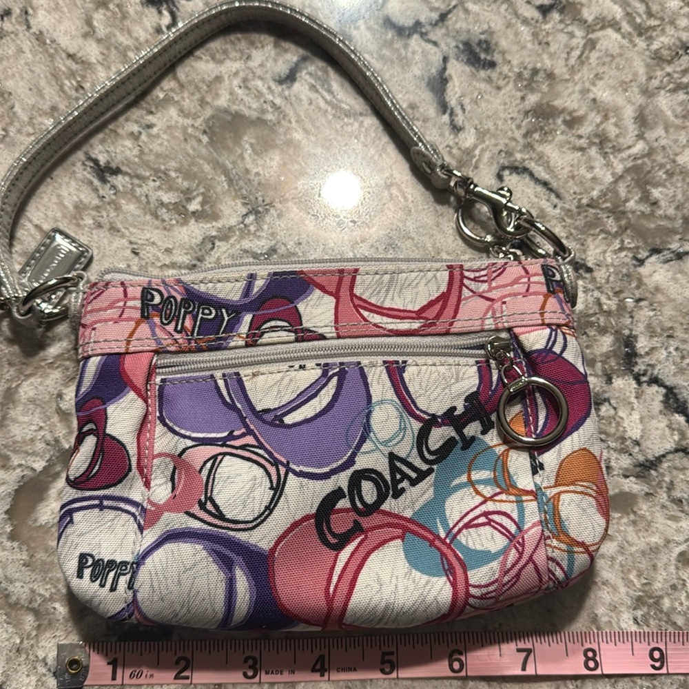 Coach poppy scribbled c 8”x5” pink and purple with silver hardware wristlet